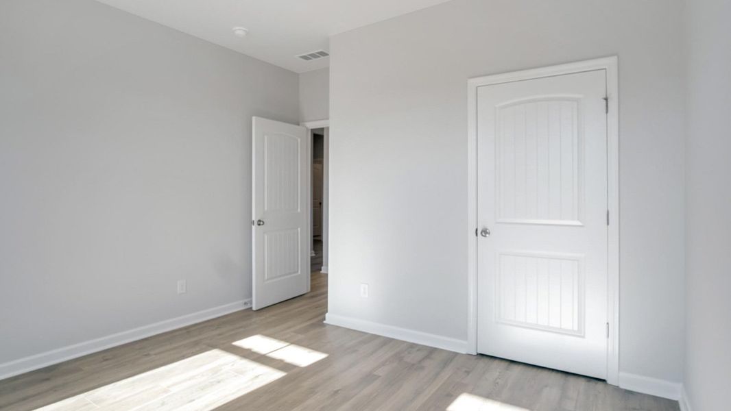 Representative unfurnished interior of a home built from the Arlington by D.R. Horton in Legacy Farms, White House (Image 32).