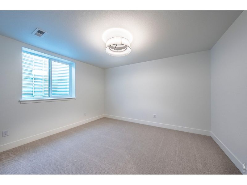 Spacious, unfurnished interior of a new home in Greenspire At Windsor Lake, Windsor (Image 23).