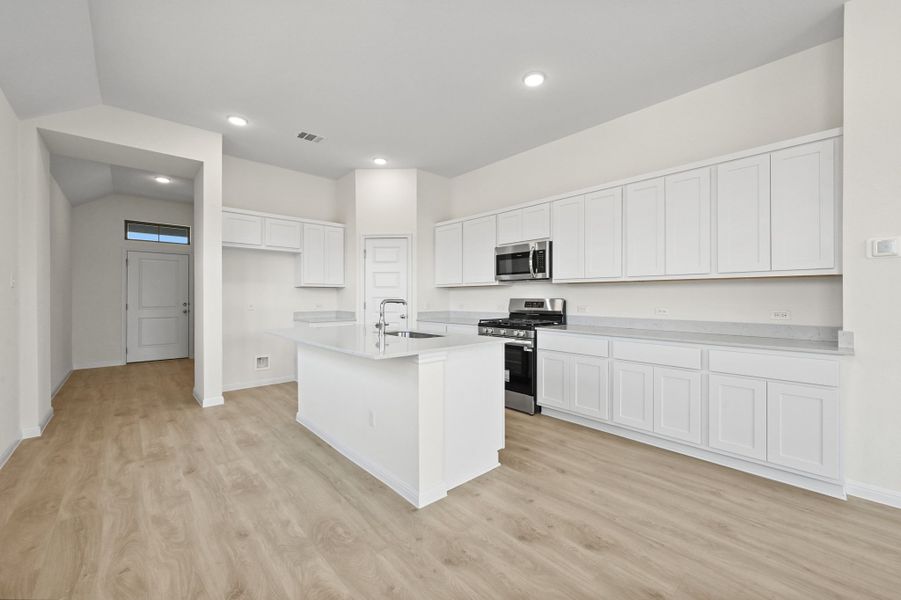 Kitchen in the Cedar home plan by Trophy Signature Homes – REPRESENTATIVE PHOTO