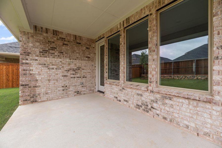 Exterior details and patio area of a home in Spiritas Ranch, Little Elm (Image 3).