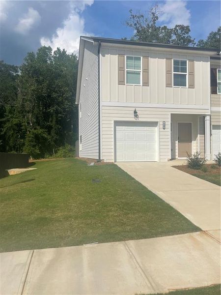 Exterior details and patio area of a home in Cambridge at Towne Center, Hoschton (Image 3).