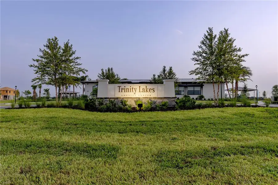 Front exterior of a new home in Trinity Lakes, Groveland, FL, highlighting curb appeal (Image 1).