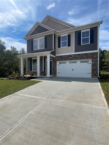 Exterior details and patio area of a home in Springwood Grove, Central (Image 2).