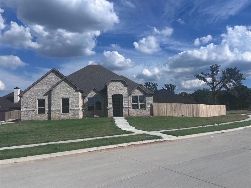 View of front of property with a front yard