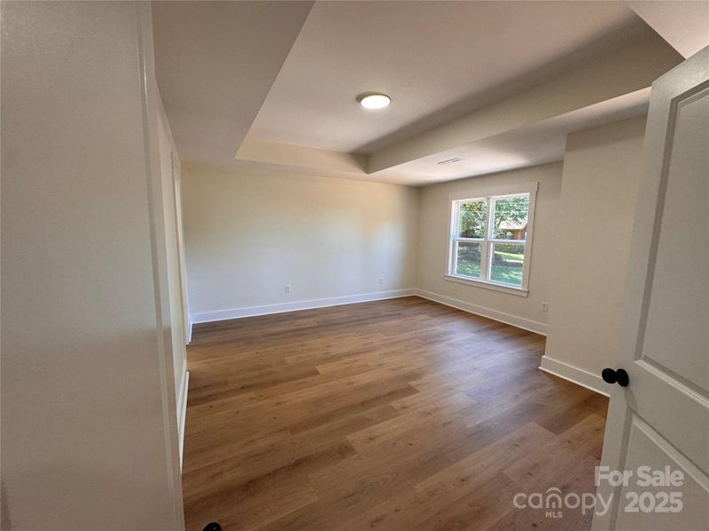Primary bedroom with double door entry