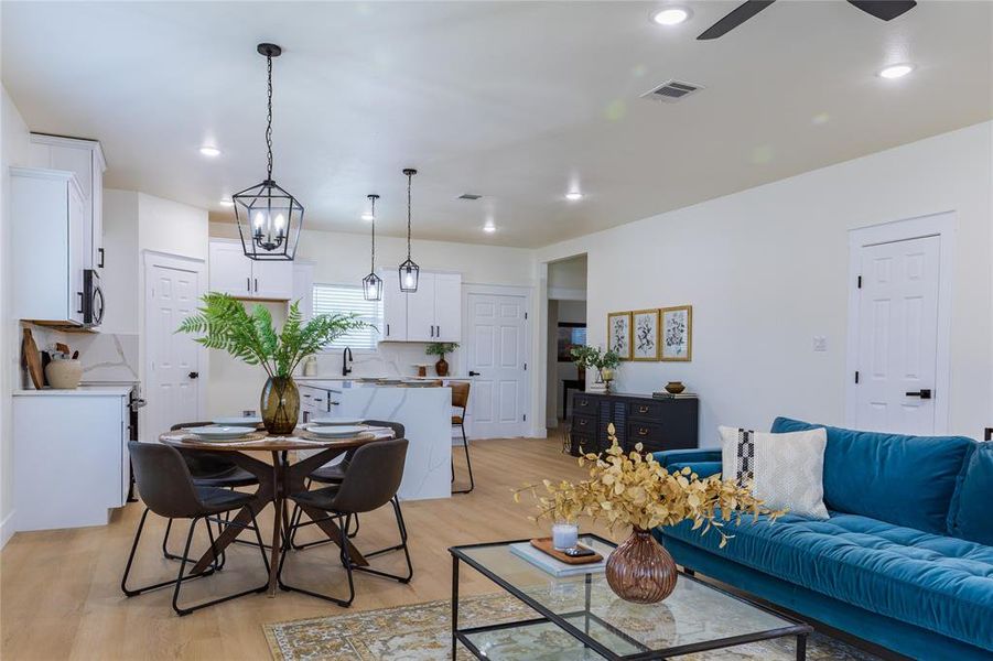 Living room featuring light wood-style flooring and recessed lighting