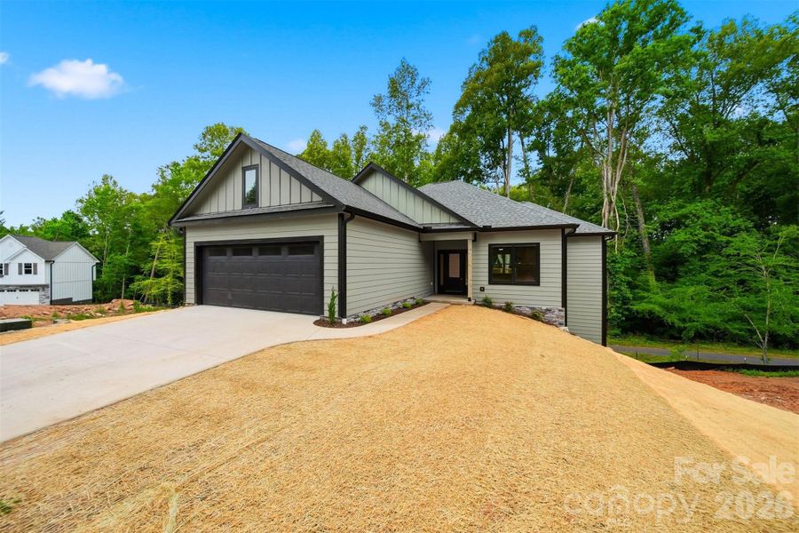 Front exterior of a new home in , Lenoir, NC, highlighting curb appeal (Image 19).