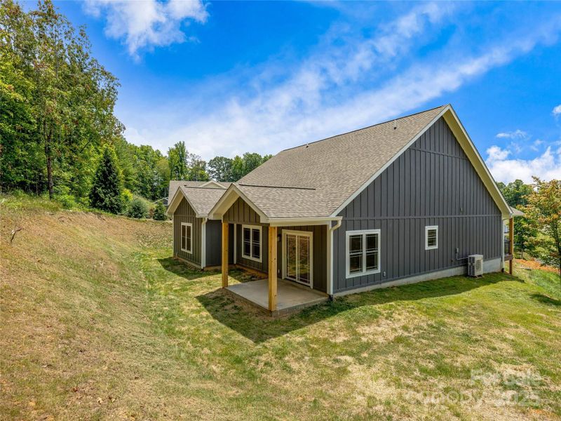 Rear / Side View. Side of Home Has Great Flat Area For Pets, Entertaining Or Adirondack Chairs & Firepit!