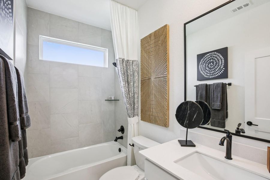 Furnished interior view inside a new home in Bridgeland, Cypress (Image 38).