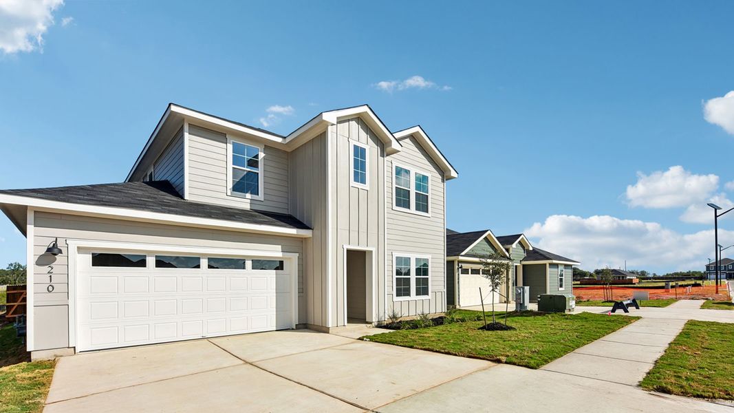 Front exterior of a new home in Watermill, Uhland, TX, highlighting curb appeal (Image 2). Front exterior of a new home in Watermill, Uhland, TX, highlighting curb appeal (Image 2).