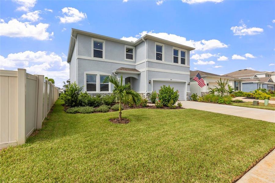 Front exterior of a new home in Silverstone North, Palmetto, FL, highlighting curb appeal (Image 1). Front exterior of a new home in Silverstone North, Palmetto, FL, highlighting curb appeal (Image 1).