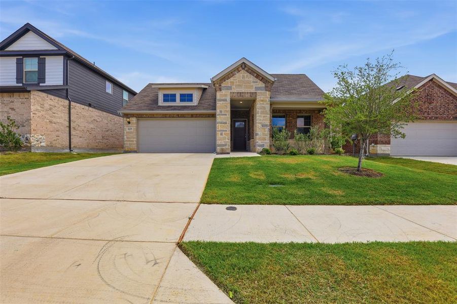 Front exterior of a new home in Tesoro at Chisholm Trail Ranch, Crowley, TX, highlighting curb appeal (Image 2). Front exterior of a new home in Tesoro at Chisholm Trail Ranch, Crowley, TX, highlighting curb appeal (Image 2).