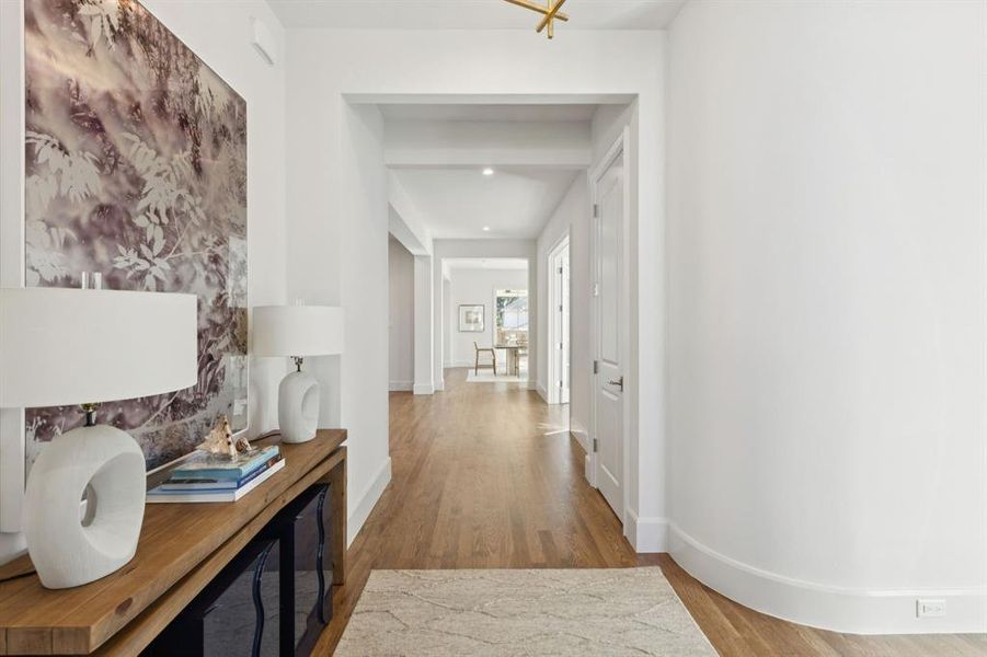 Corridor with wood finished floors and baseboards Corridor with wood finished floors and baseboards