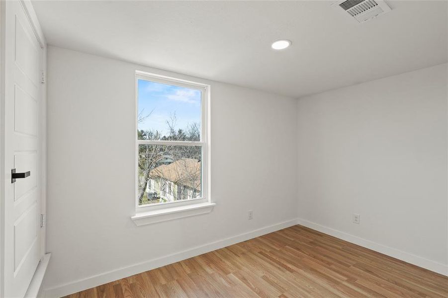 Spare room with light hardwood / wood-style floors