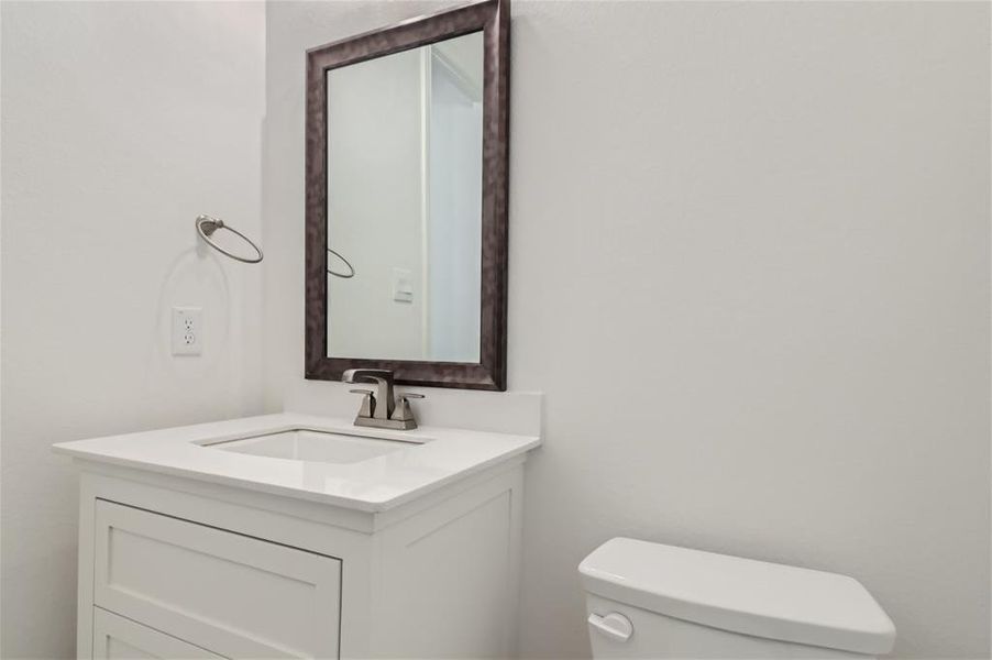 Bathroom with vanity and toilet