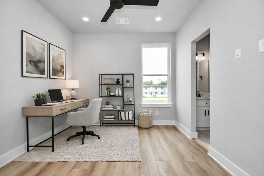 Versatile guest bedroom that can easily function as a home office. Bright, modern space designed for comfort and productivity.