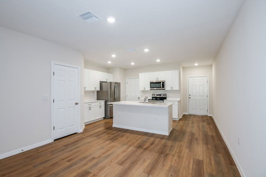 Furnished interior view inside a new home in Pasadena Woods, Dade City (Image 6).