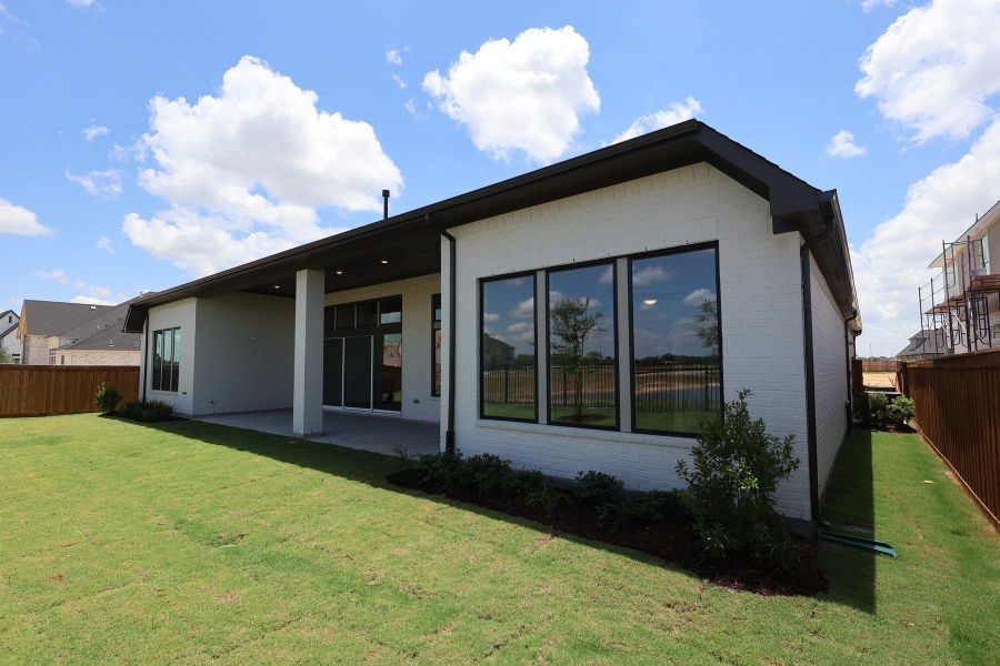 Exterior details and patio area of a home in Dunham Pointe, Cypress (Image 3). Exterior details and patio area of a home in Dunham Pointe, Cypress (Image 3).