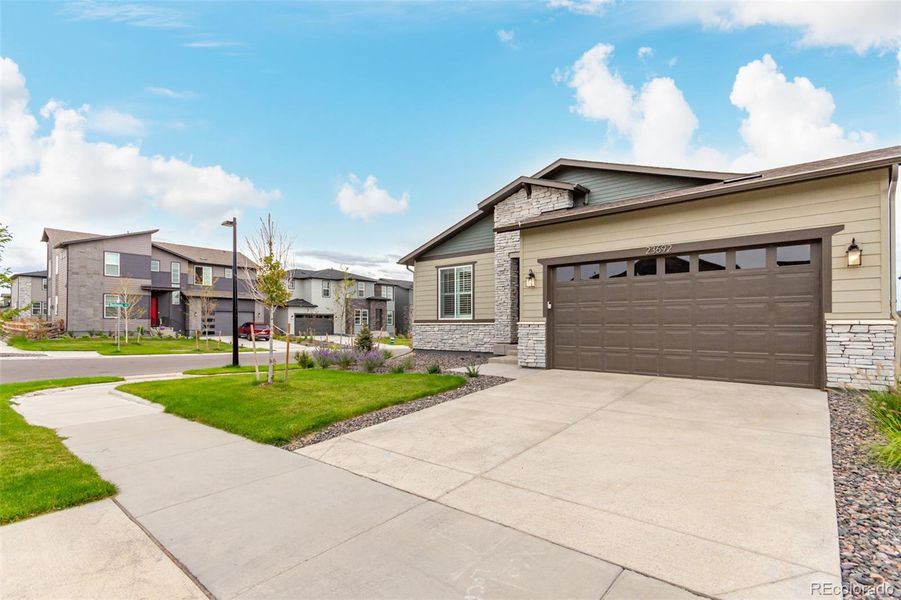 Front exterior of a new home in , Aurora, CO, highlighting curb appeal (Image 24).