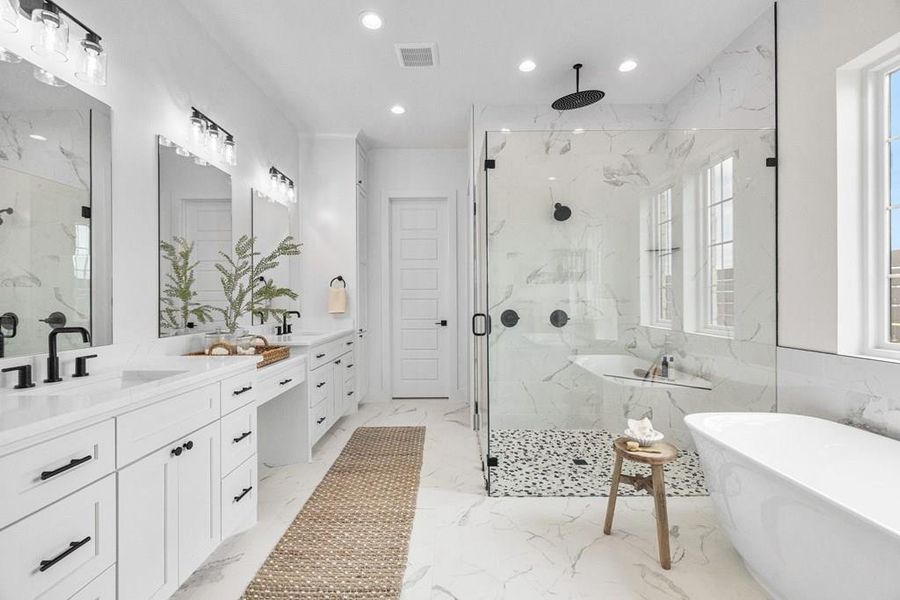 Primary ensuite bath with a walk in shower, a soaking tub, double vanity with natural light streaming in. Primary ensuite bath with a walk in shower, a soaking tub, double vanity with natural light streaming in.