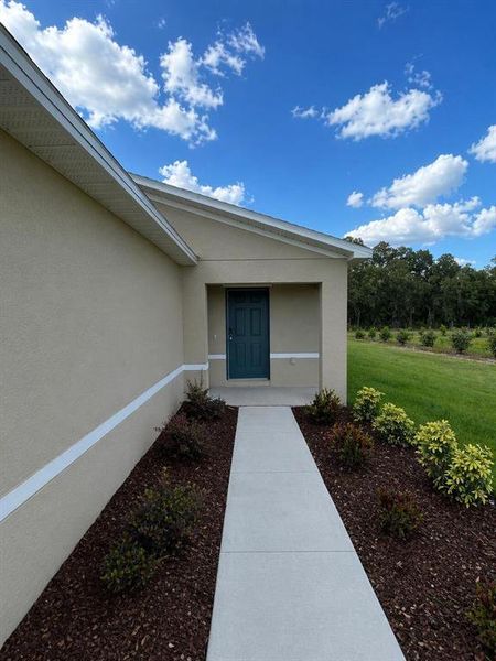 Exterior details and patio area of a home in Eagle Hammock, Eagle Lake (Image 22).