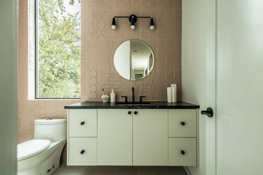 45 degree cut tile installation, attention to detail. Floating vanity with LED light.