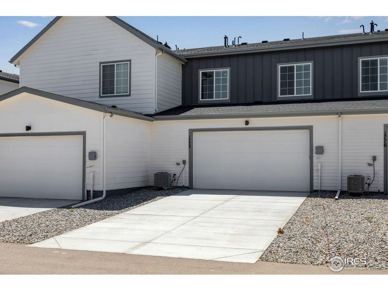 Front exterior of a new home in , Berthoud, CO, highlighting curb appeal (Image 19).
