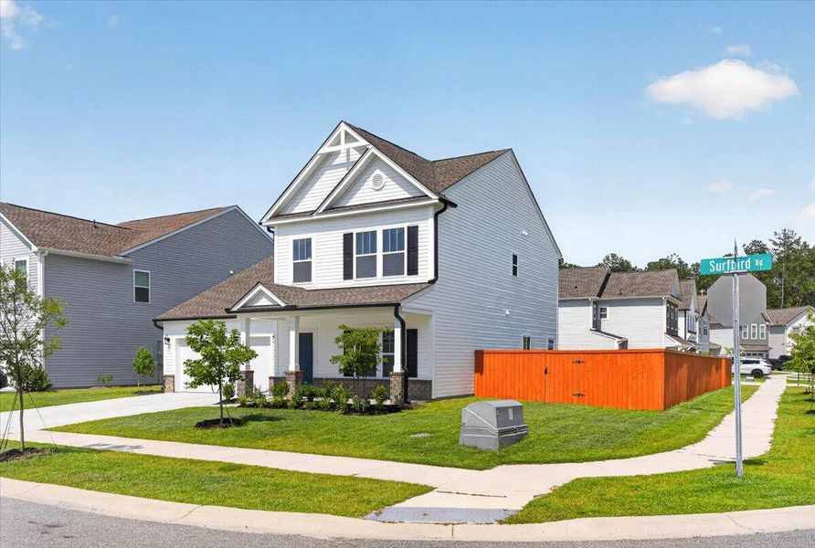 Front exterior of a new home in North Creek at Nexton, Summerville, SC, highlighting curb appeal (Image 2). Front exterior of a new home in North Creek at Nexton, Summerville, SC, highlighting curb appeal (Image 2).
