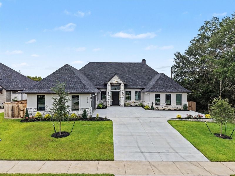 Front exterior of a new home in , College Station, TX, highlighting curb appeal (Image 22). Front exterior of a new home in , College Station, TX, highlighting curb appeal (Image 22).
