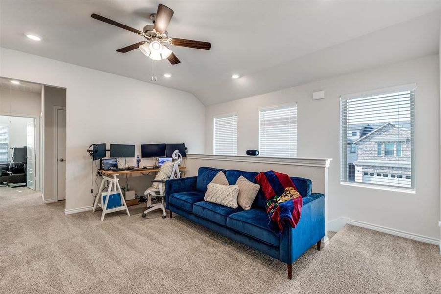 Living room featuring a desk, light carpet, recessed lighting, attic access, and vaulted ceiling Living room featuring a desk, light carpet, recessed lighting, attic access, and vaulted ceiling