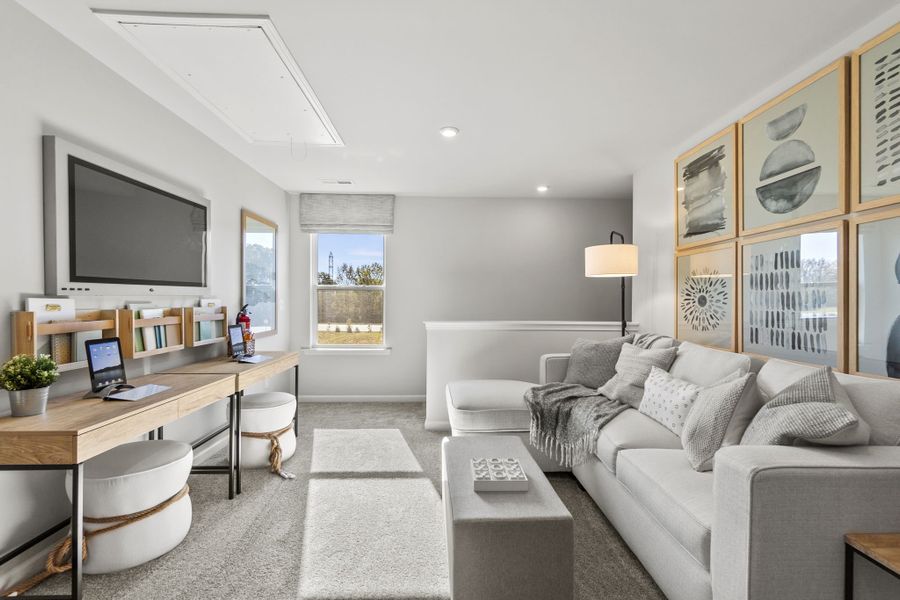 A living room with a large tv and a couch.