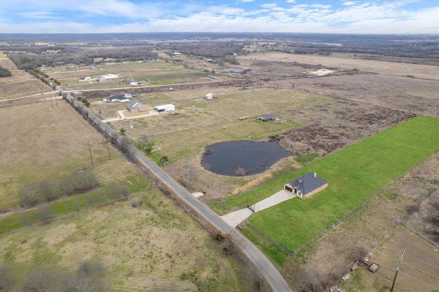 Birds eye view of property featuring a rural view