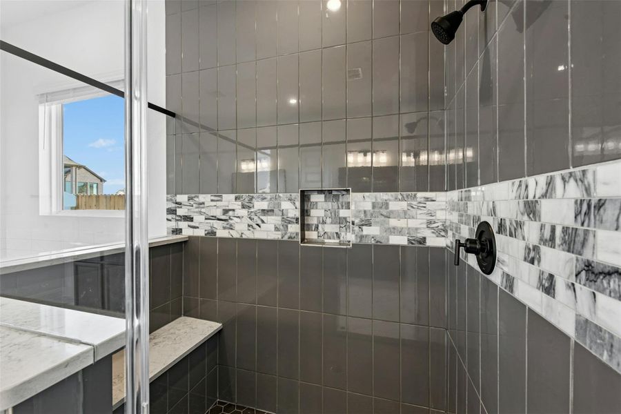 Full bathroom with tiled shower