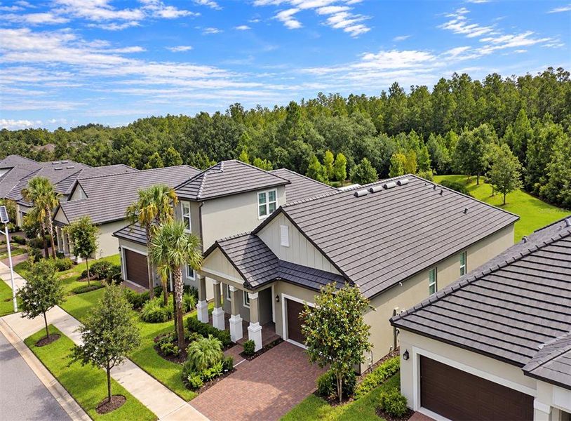 Front exterior of a new home in Angeline Active Adult, Land O' Lakes, FL, highlighting curb appeal (Image 24).