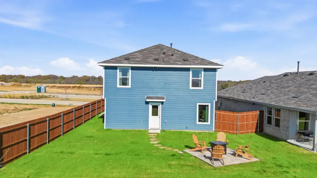Exterior details and patio area of a home in Ponder Farms, Ponder (Image 2).