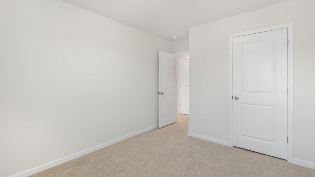 Spacious, unfurnished interior of a new home in The Townes at Galvins Ridge, Sanford (Image 21).