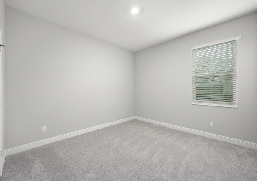 Second bedroom with a window that features 2' faux wood blinds