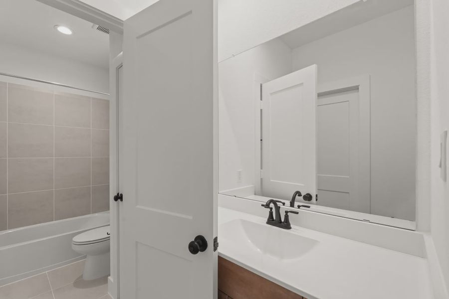 Representative furnished interior of a home built from the Sorenstam by Chesmar Homes in Riceland Alley Loads, Mont Belvieu (Image 53).