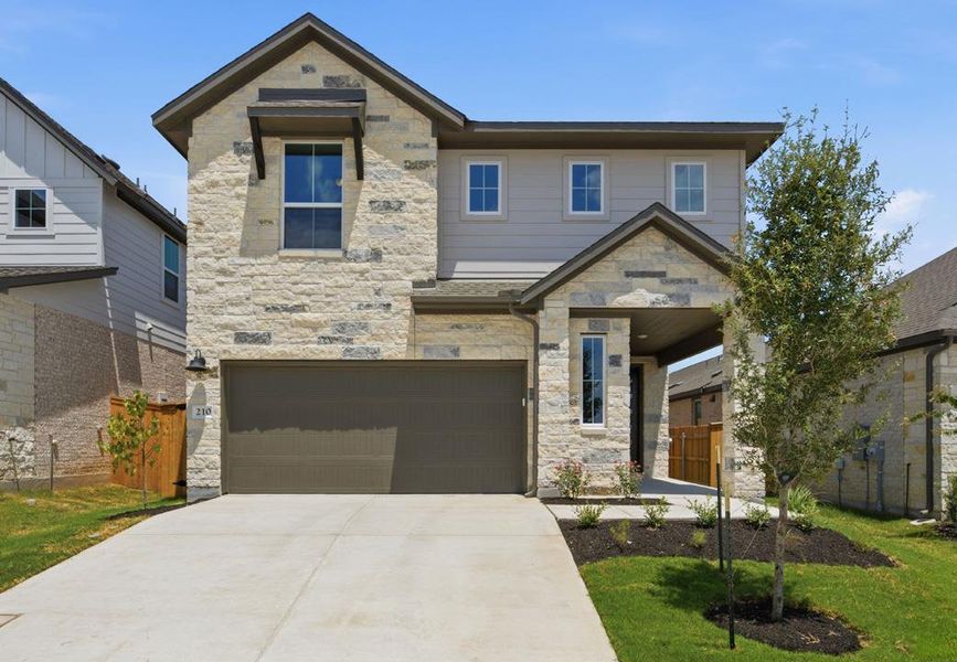 Front exterior of a new home in Heritage, Dripping Springs, TX, highlighting curb appeal (Image 20).