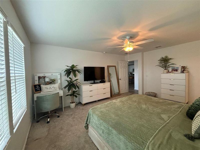 Bedroom featuring carpet flooring and a ceiling fan