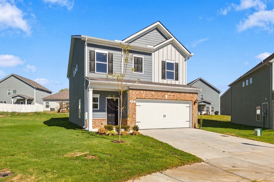 Front exterior of a new home in Winston Place, Gallatin, TN, highlighting curb appeal (Image 2). Front exterior of a new home in Winston Place, Gallatin, TN, highlighting curb appeal (Image 2).