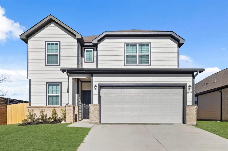 Front exterior of a new home in Retreat at Fossil Creek, Fort Worth, TX, highlighting curb appeal (Image 1). Front exterior of a new home in Retreat at Fossil Creek, Fort Worth, TX, highlighting curb appeal (Image 1).