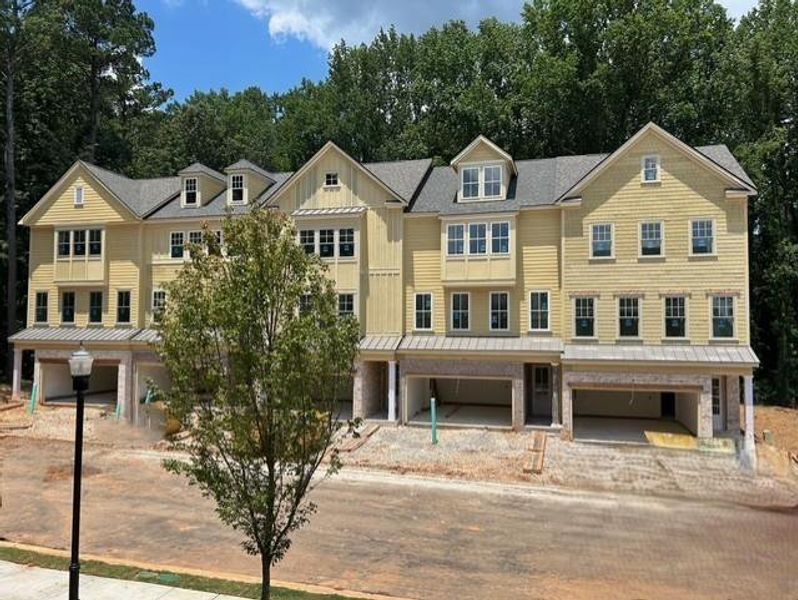 Front exterior of a new home in Devin's Shire, Kennesaw, GA, highlighting curb appeal (Image 21).