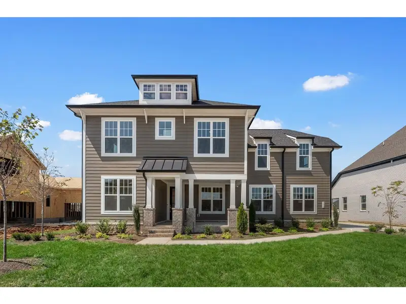 Front exterior of a new home in Shelton Square, Murfreesboro, TN, highlighting curb appeal (Image 1). Front exterior of a new home in Shelton Square, Murfreesboro, TN, highlighting curb appeal (Image 1).