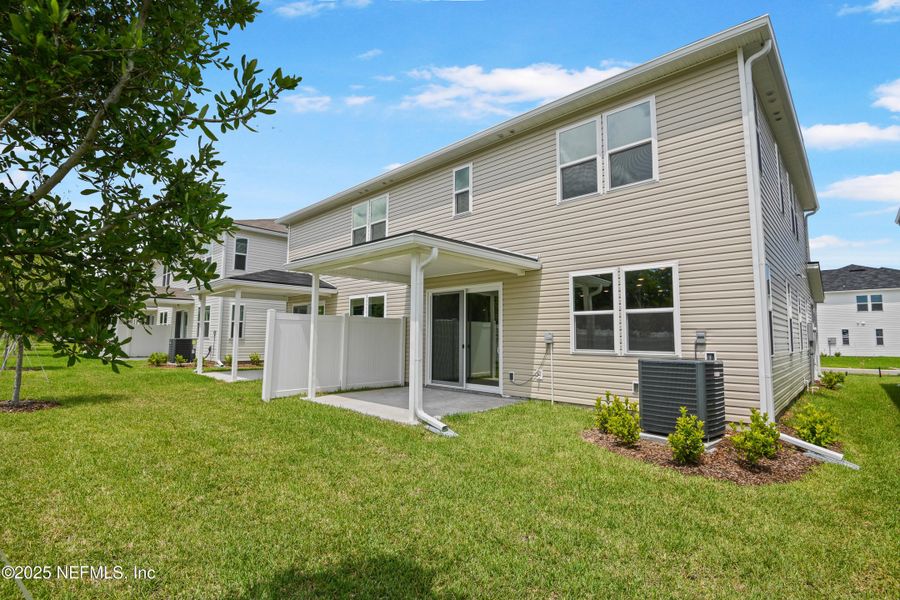 Front exterior of a new home in , Jacksonville, FL, highlighting curb appeal (Image 1).