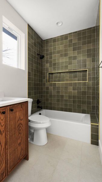 Full bath with vanity, shower / bath combination, and light tile patterned floors
