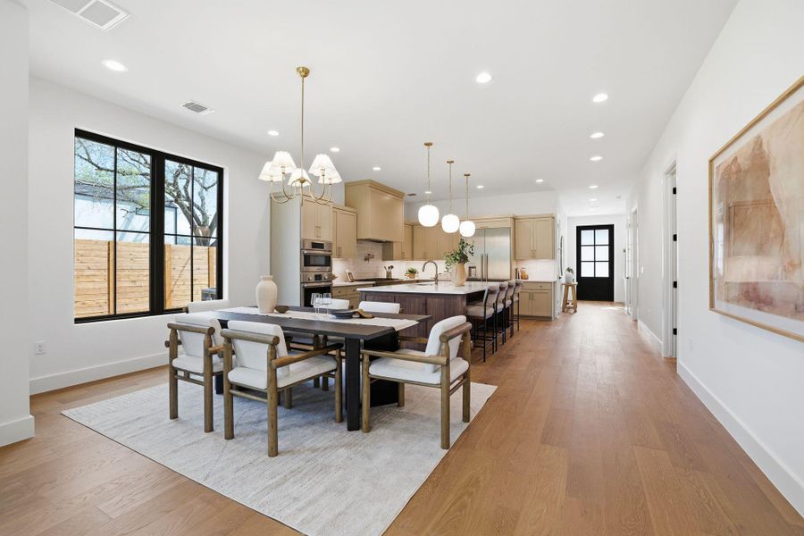 Dining room featuring a chandelier and light wood finished floors