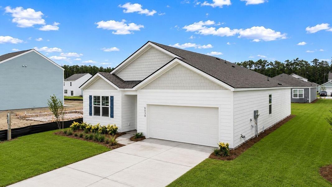 Front exterior of a new home in Hillcrest, Ravenel, SC, highlighting curb appeal (Image 2). Front exterior of a new home in Hillcrest, Ravenel, SC, highlighting curb appeal (Image 2).