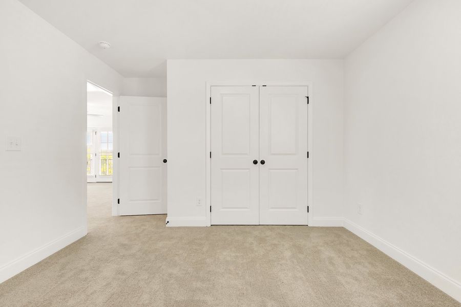 Representative unfurnished interior of a home built from the Titusville II by Regent Homes in Marlon's Creek, Spring Hill (Image 39).