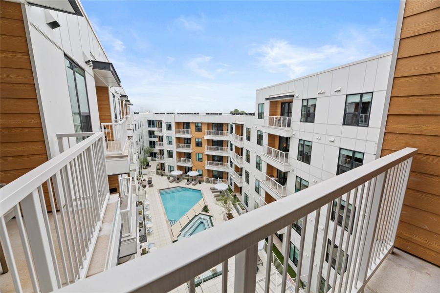 Private outdoor balconies overlook a central courtyard complete with a sparkling swimming pool. Private outdoor balconies overlook a central courtyard complete with a sparkling swimming pool.